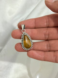 Dije Gota de Ojo de Tigre Natural en Plata .950